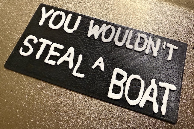 3D-printed sign reading 